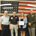Brittany Hansen is presented with the Patriot Award from the ESGR